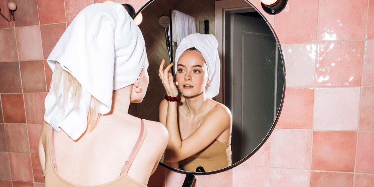 girl-mirror-bathroom-skincare